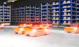 Automated robots driving around a warehouse floor