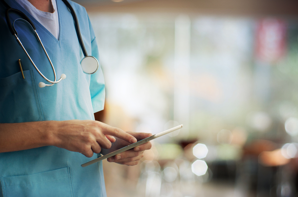 Medical professional using tablet